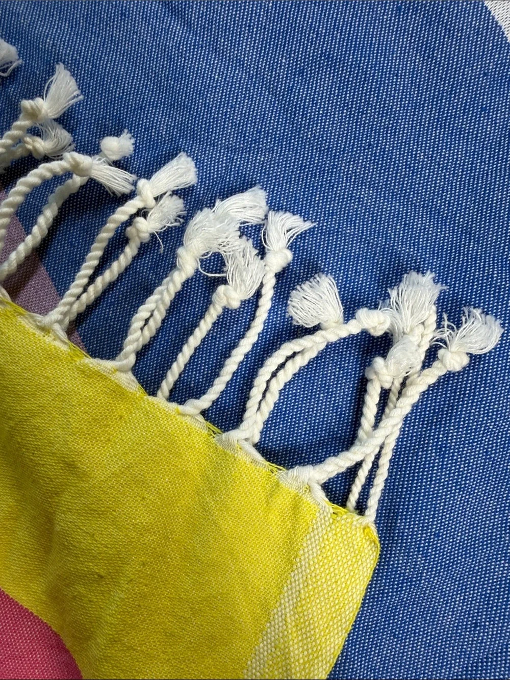 Fun colorful cotton tablecloth with corded fringe blue, white, pink, and yellow